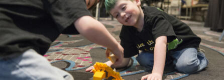 Declan Reagan, 5, right, plays with his twin brother, Adrian, during a bone marrow and blood donation event March 28 at The Nines hotel in Portland. Declan needs a lifesaving bone marrow transplant.