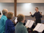 Salmon Creek United Methodist Church only meant to hire a vocal music director when it found Matt Compton. It turns out that Compton, 22, is an accomplished handbell ringer and composer. Here, he leads the church handbell choir through rehearsals for Easter services. He&#039;ll offer free public handbell workshops on Saturday.