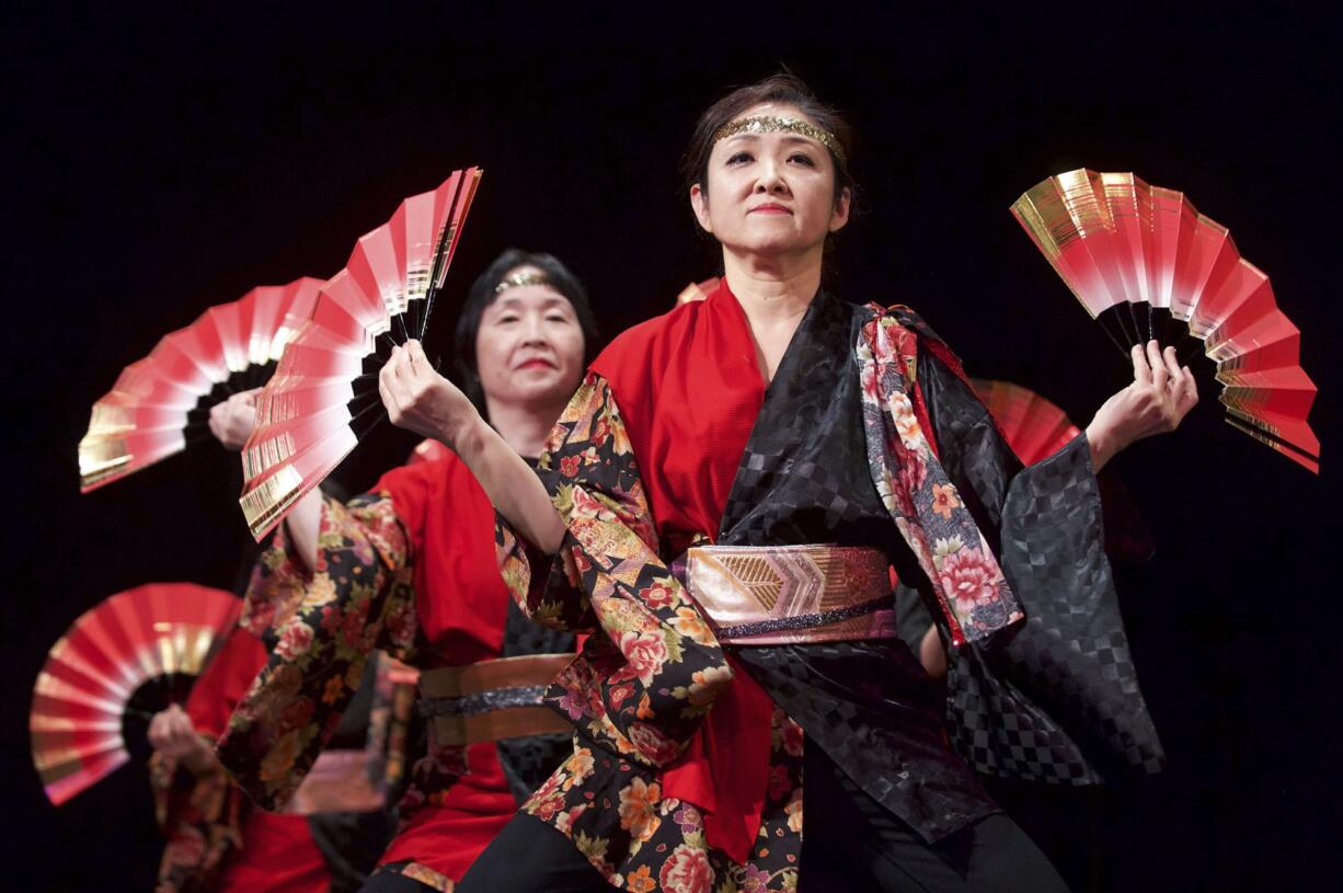 Kikuyo Jurgens, in the foreground, performs with Dance Leo, a Japanese dance ensemble, in Gaiser Hall at Clark College during the college's 2017 Sakura Festival on Thursday.