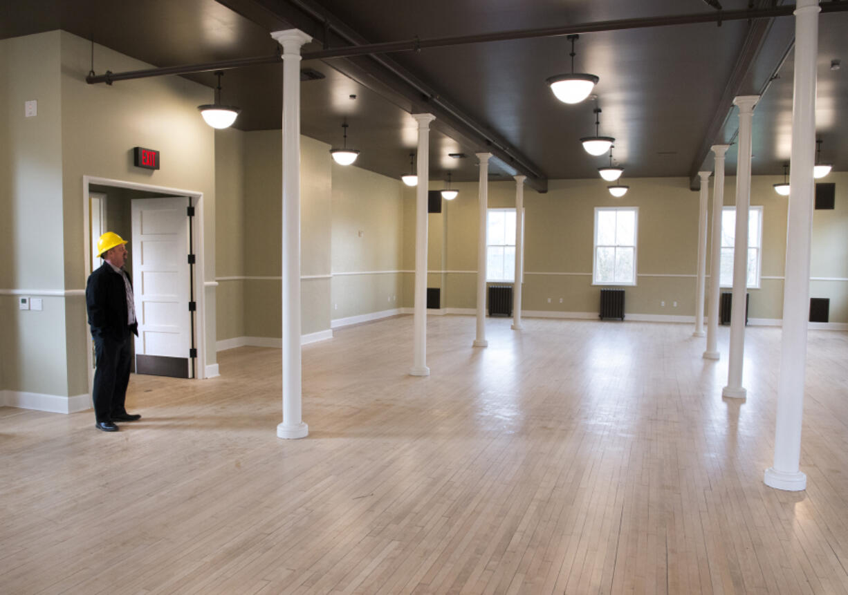 Kaare Hyde, the facilities manager at Fort Vancouver National Trust, looks around an empty room at the Artillery Barracks. The Trust and other government agencies have worked to make the historic U.S.