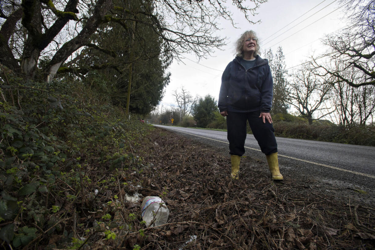 Cheryll McAtee and her neighbors live along a rural stretch of Northeast Fourth Plain Road. The residents regularly deal with people throwing trash along their road.