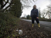 Cheryll McAtee and her neighbors live along a rural stretch of Northeast Fourth Plain Road. The residents regularly deal with people throwing trash along their road.