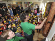 Bee mentor Brian Lacy of Urban Bees and Gardens explains an observation honeybee hive installed in a preschool classroom at the Gardner School of Arts and Sciences in Vancouver. Lacy, who teaches people about the importance of pollinators, hung the plexiglass bee hive on Friday.