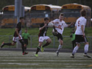 Union's Miguel De La Melena (3) battles Camas' Tybalt Thornberry (22) for the ball in a match Friday.