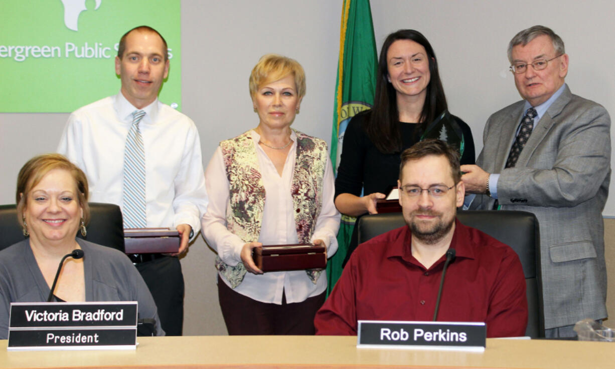 Landover-Sharmel: Evergreen Public Schools&#039; first set of Evergreen Awards winners, back row from left, Stuart Anderson of Riverview Elementary School, Nataliya Quandt of Fisher&#039;s Landing Elementary School and Karrie Fansler of Covington Middle School with Superintendent John Deeder and, front row from left, Victoria Bradford, president of the school board, and Rob Perkins, school board member.