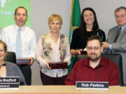 Landover-Sharmel: Evergreen Public Schools&#039; first set of Evergreen Awards winners, back row from left, Stuart Anderson of Riverview Elementary School, Nataliya Quandt of Fisher&#039;s Landing Elementary School and Karrie Fansler of Covington Middle School with Superintendent John Deeder and, front row from left, Victoria Bradford, president of the school board, and Rob Perkins, school board member.