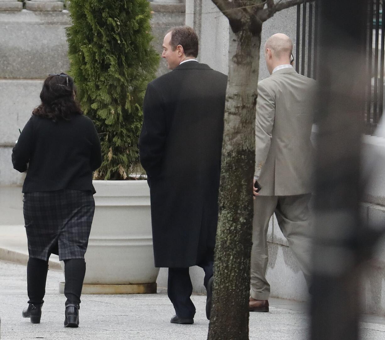 House Intelligence Committee ranking member Rep. Adam Schiff, D-Calif., center, is seen leaving the White House complex in Washington, Friday, March 31, 2017.