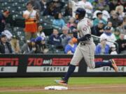 Houston Astros' George Springer rounds the bases after hitting a solo home run during the first inning of the team's baseball game against the Seattle Mariners, Tuesday, April 11, 2017, in Seattle. (AP Photo/Ted S.