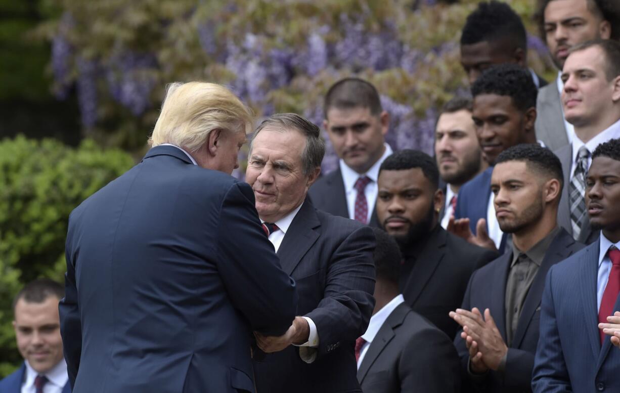 President Donald Trump shakes hands with New England Patriots head coach Bill Belichick during a ceremony on the South Lawn of the White House in Washington, Wednesday, April 19, 2017, where the president honored the Super Bowl Champion New England Patriots for their Super Bowl LI victory.