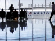 A Delta Airlines jet sits at a gate at Hartsfield-Jackson Atlanta International Airport in Atlanta in  2016.