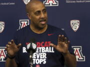 Lorenzo Romar answers questions during an NCAA college basketball press conference, Thursday, April 20, 2017, at the University of Arizona in Tucson, Ariz. Romar, the former head men&#039;s basketball coach at the University of Washington, joined the staff of Arizona coach Sean Miller, who used to be one of his chief rivals.