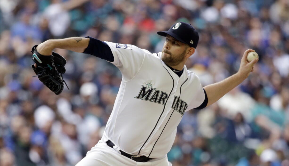 Seattle Mariners starting pitcher James Paxton throws against the Houston Astros in the first inning of a baseball game, Monday, April 10, 2017, in Seattle. The game is the home opener for the Mariners.