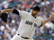 Seattle Mariners starting pitcher James Paxton throws against the Houston Astros in the first inning of a baseball game, Monday, April 10, 2017, in Seattle. The game is the home opener for the Mariners.