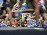 Runners in the first wave cross the line at the start of the 2017 Boston Marathon in Hopkinton, Mass., Monday, April 17, 2017.