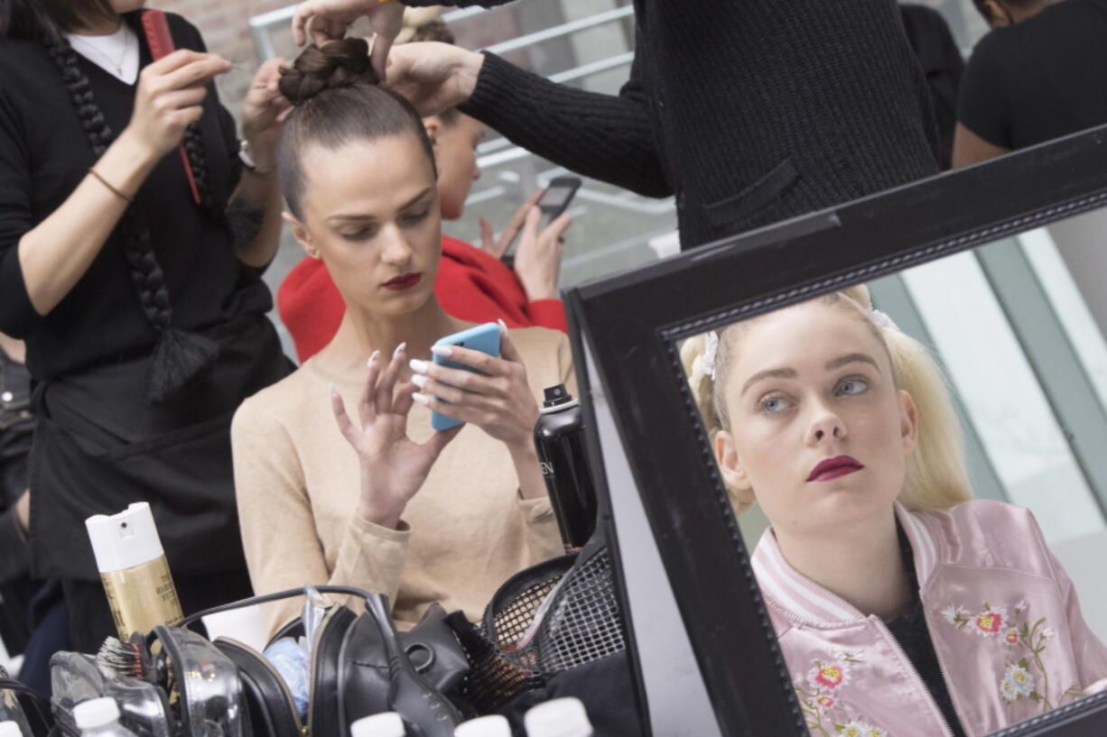 In this April 21, 2017 photo, models appear backstage before the Ines Di Santo bridal collection presentation during bridal fashion week in New York.