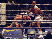 British boxer Anthony Joshua, right, knocks down Ukrainian boxer Wladimir Klitschko as they fight for Joshua&#039;s IBF and the vacant WBA Super World and IBO heavyweight titles at Wembley stadium in London, Saturday, April 29, 2017. Joshua won with an 11th round stoppage.