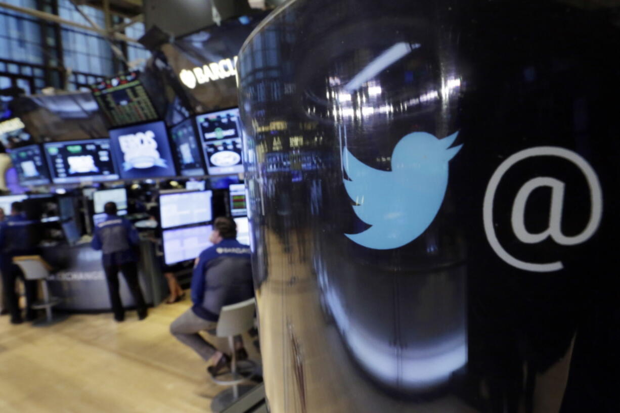 The Twitter logo appears on a phone post on the floor of the New York Stock Exchange.