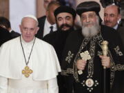 Pope Francis, left, is flanked by Pope Tawadros II, spiritual leader of Egypt&#039;s Orthodox Christians, 2nd from right, at Cairo&#039;s St. Mark&#039;s Cathedral, Friday, April 28, 2017. Francis is in Egypt for a two-day trip aimed at presenting a united Christian-Muslim front that repudiates violence committed in God&#039;s name.