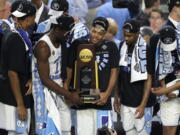 North Carolina players celebrate with the trophy after the championship game against Gonzaga at the Final Four NCAA college basketball tournament, Monday, April 3, 2017, in Glendale, Ariz. North Carolina 71-65.