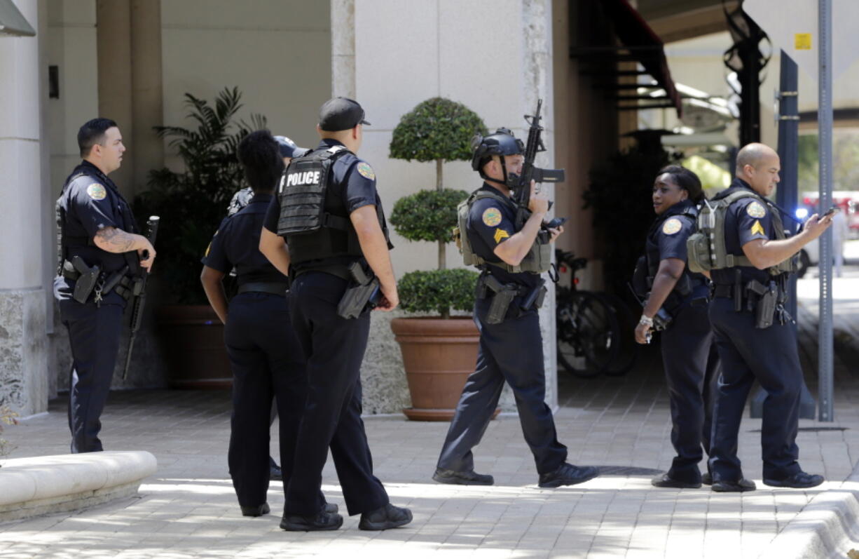 Police patrol outside of the Shops at Merrick Park after a shooting, Saturday, April 8, 2017, in Coral Gables, Fla.   Alvaro Zabaleta of the Miami-Dade Police Department says detectives have responded to the scene of the shooting in the upscale shopping mall in South Florida.