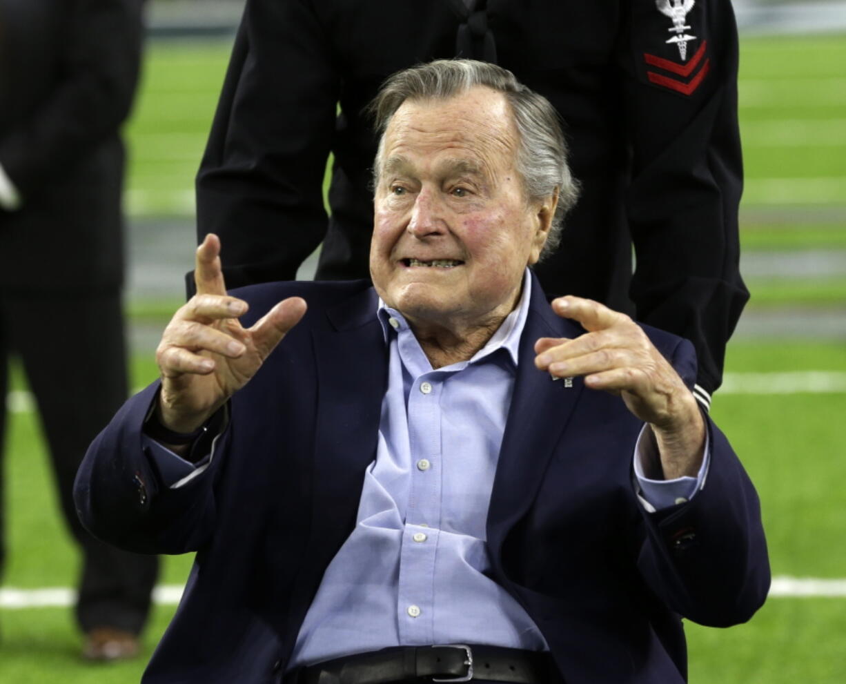 FILE - In this Feb. 5, 2017, file photo, former President George H.W. Bush arrives on the field for a coin toss before the NFL Super Bowl 51 football game between the Atlanta Falcons and the New England Patriots in Houston. Bush has been hospitalized in Houston since last Friday, Aprul 14, 2017,  with a recurrence of a case of pneumonia he had earlier in the year. Bush spokesman Jim McGrath said in a statement Tuesday, April 18, 2017, doctors determined he had a mild case of pneumonia which has been treated and resolved.