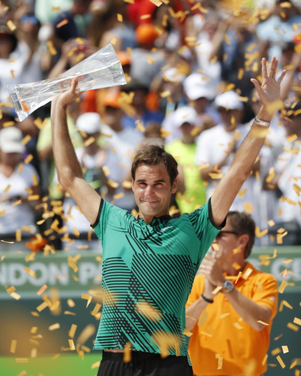 Roger Federer, of Switzerland, holds up his trophy after defeating Rafael Nadal, of Spain, during the men&#039;s singles final tennis match at the Miami Open, Sunday, April 2, 2017 in Key Biscayne, Fla.