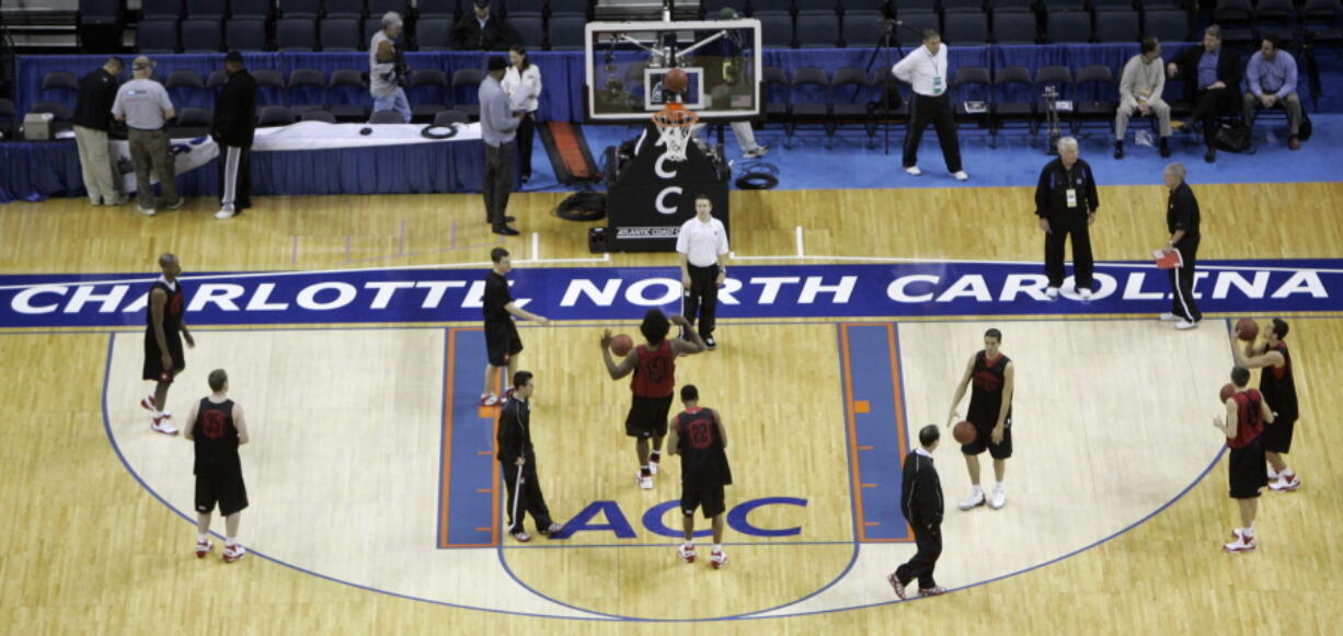 Maryland players practice for the Atlantic Coast Conference men's NCAA college basketball tournament at Bobcats Arena in Charlotte, N.C., in 2008.  The NCAA says it will consider North Carolina as a host for championship events again after the state rolled back a law that limited protections for LGBT people. In a statement Tuesday, April 4, 2017, the governing body said its Board of Governors had reviewed moves to repeal repealed the so-called &quot;bathroom bill&quot; and replace it with a compromise law.