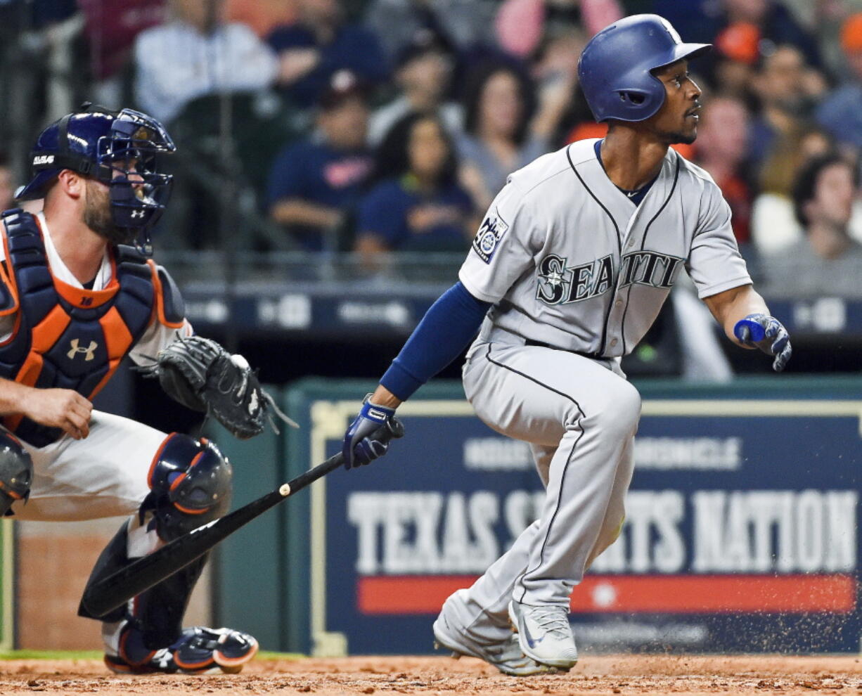 Seattle Mariners&#039; Jarrod Dyson watches his go-ahead RBI single in the ninth inning of the team&#039;s baseball game against the Houston Astros, Thursday, April 6, 2017, in Houston.