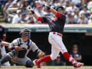 Cleveland Indians&#039; Michael Brantley watches his two-run home run as Seattle Mariners catcher Carlos Ruiz looks on during the third inning in a baseball game, Sunday, April 30, 2017, in Cleveland.