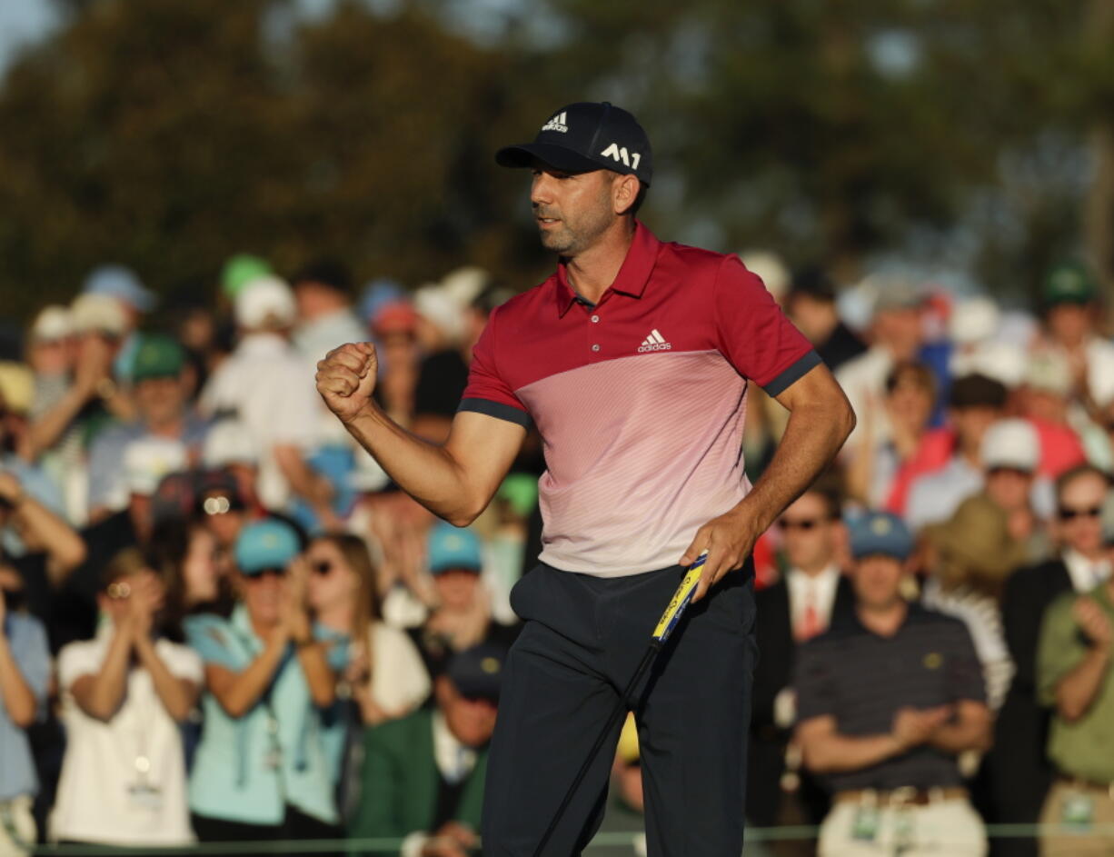 Sergio Garcia, of Spain, reacts after making his putt on the 18th hole during the third round of the Masters golf tournament Saturday, April 8, 2017, in Augusta, Ga.