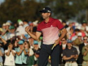 Sergio Garcia, of Spain, reacts after making his putt on the 18th hole during the third round of the Masters golf tournament Saturday, April 8, 2017, in Augusta, Ga.