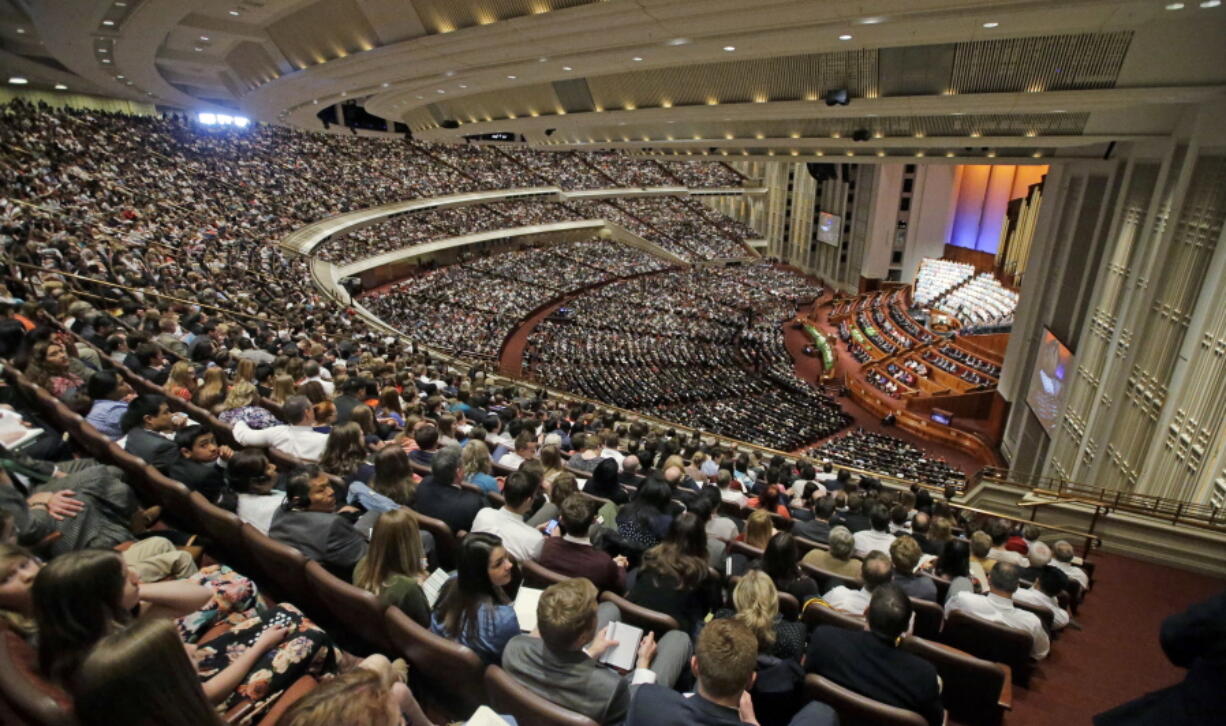 People attend the afternoon session of the two-day Mormon church conference Saturday in Salt Lake City.