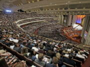 People attend the afternoon session of the two-day Mormon church conference Saturday in Salt Lake City.