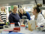 U.S. Sen. Patty Murray, D-Wash., second from left, visits with Kennidy Takehara, right, a lab technician in an immunology research lab at the University of Washington&#039;s UW Medicine South Lake Union Campus on April 12 in Seattle. Murray visited the lab Wednesday to discusses the potential impact to research being done there by President Donald Trump&#039;s proposed budget cuts to the National Institute of Health. (AP Photo/Ted S.