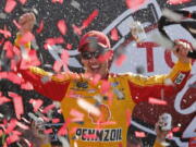 Joey Logano celebrates after winning the NASCAR Cup Series auto race in Victory Lane at Richmond International Raceway in Richmond, Va., Sunday, April 30, 2017.