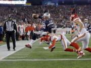 Chiefs free safety Husain Abdullah (39) pushes Patriots quarterback Tom Brady (12) out of bounds short of the goal line during a 2016 divisional game in Foxborough, Mass. The two teams will kick off the 2017 regular season against each other on Sept. 7.