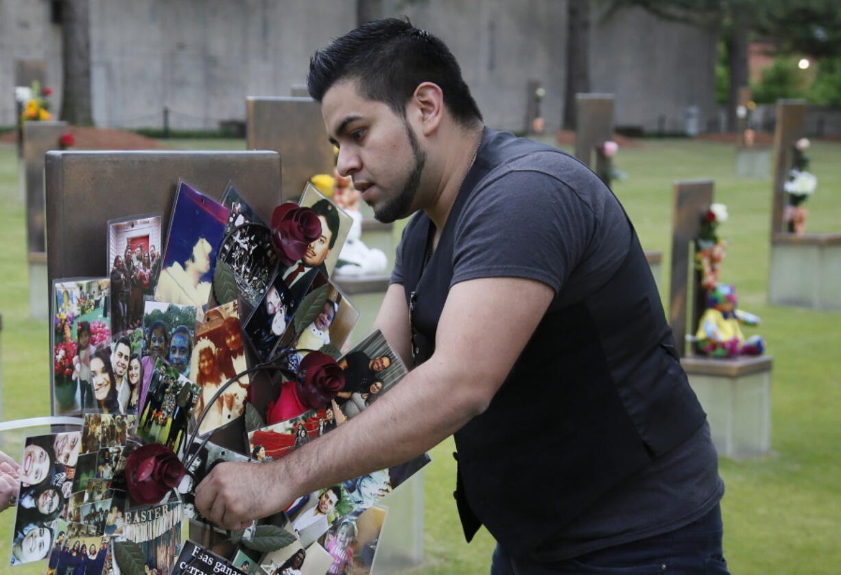 Brian Martinez, 31, attaches a wreath made of family photos to his father&#039;s chair in the Field of Chairs at the Oklahoma City Memorial in Oklahoma City on Wednesday, the 22nd anniversary of the Oklahoma City bombing, which killed is father, Rev. Gilbert X. Martinez.Survivors and family members of those killed in the Oklahoma City bombing will gather for a remembrance service Wednesday, the 22nd anniversary of the attack. Carson is speaking at the 22nd Anniversary Remembrance Ceremony.