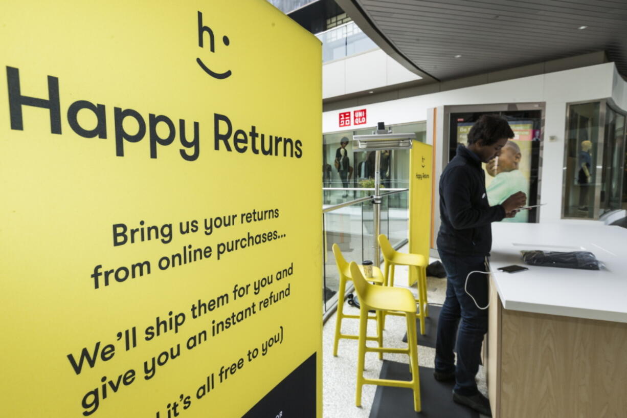 Happy Returns &quot;return-ista&quot; Taj Sims processes a customer&#039;s return at the company&#039;s kiosk designed to make it easier for buyers of online merchandise to be returned, at the Santa Monica Place mall in Santa Monica, Calif.