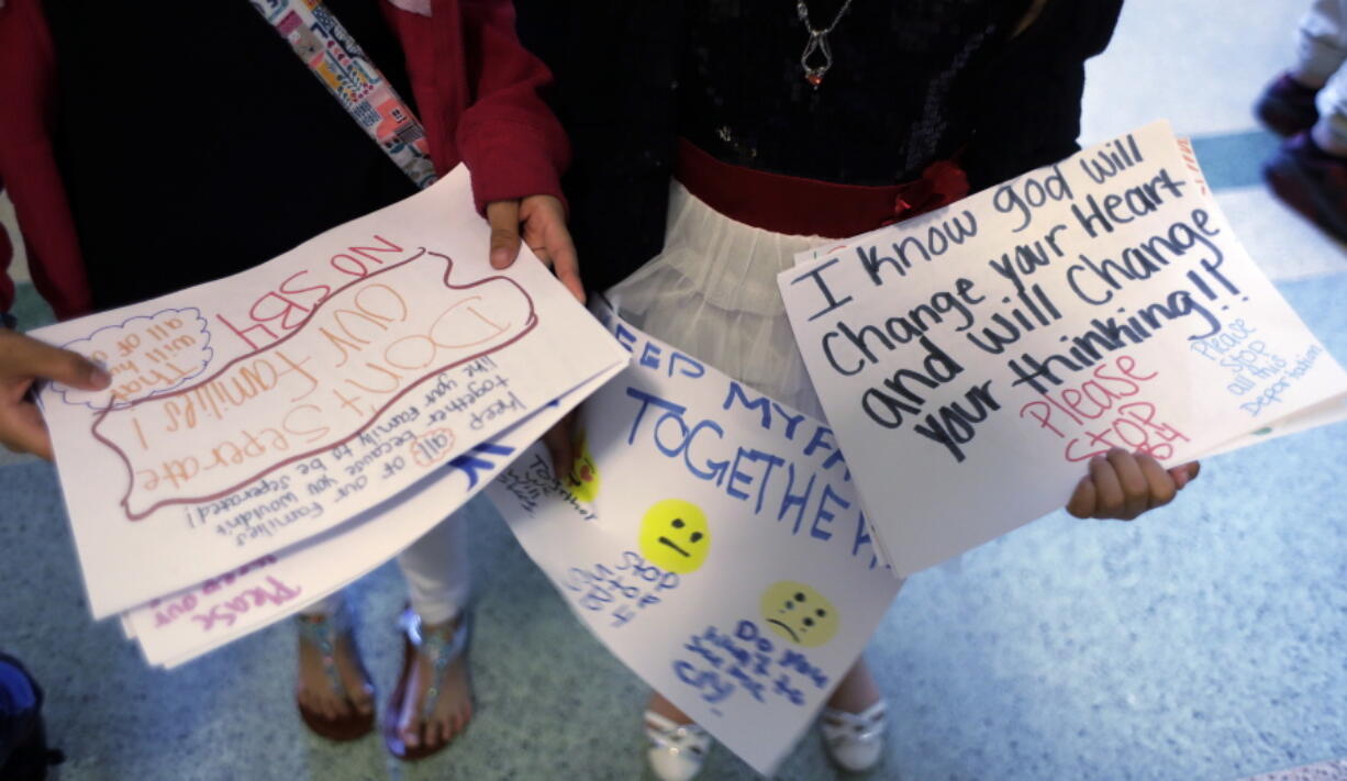 Students hand out hand-made signs and letters opposing SB4, an anti-&quot;sanctuary cities&quot; bill that already cleared the Texas Senate and seeks to jail sheriffs and other officials who refuse to help enforce federal immigration law, as the Texas House prepares to debate the bill, Wednesday, in Austin, Texas.  Many sheriffs and police chiefs in heavily Democratic areas warn that it will make their jobs harder if immigrant communities, including crime victims and witnesses,  become afraid of police.