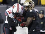 Colorado defensive back Tedric Thompson, right, was selected by the Seattle Seahawks in the fourth round of the NFL draft Saturday, April 29.