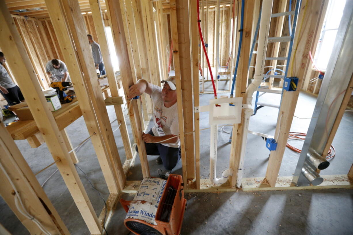 Chris Piazza, an electrician with Tasch Electric, works on a home being built by Zach Tyson of Tyson Construction, in Destrahan, La., on March 24. General contractors and other small businesses in the remodeling industry can look forward to strong growth in the coming years, but the big force behind that business may be surprising: baby boomers. Tyson estimates that between 30 percent and 40 percent of his revenue is coming from boomer renovations, up from 15 percent to 20 percent five years ago.