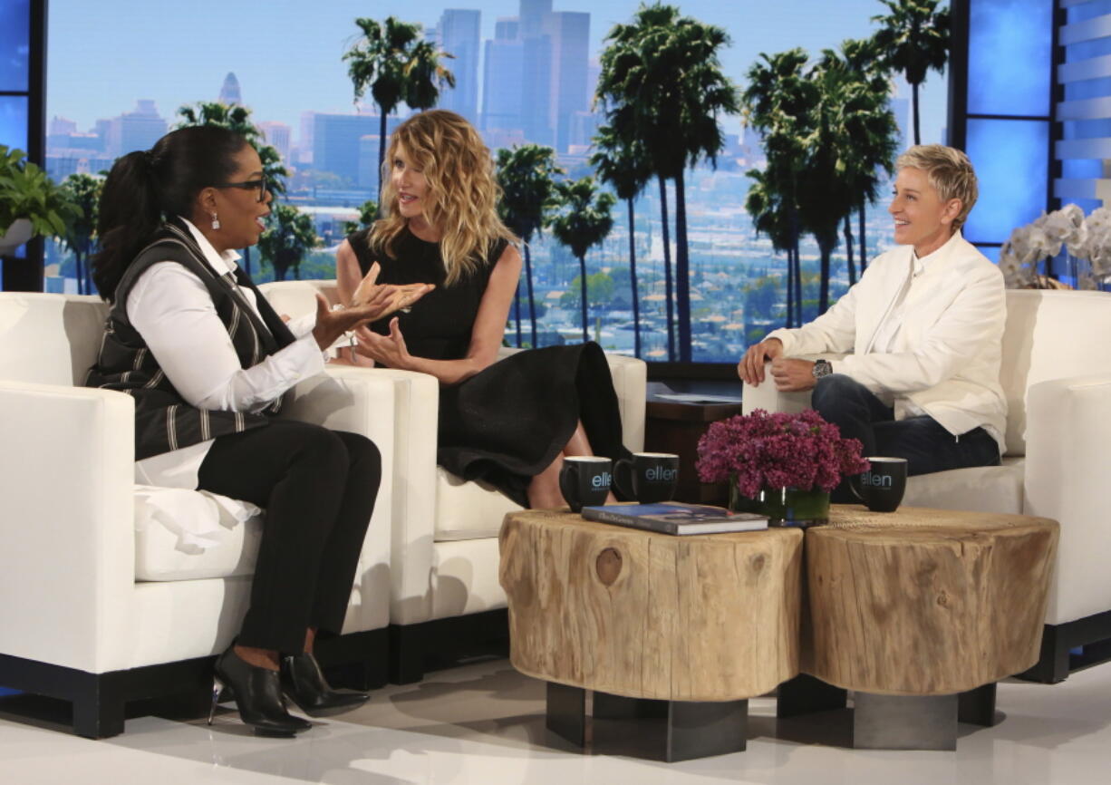 Oprah Winfrey, left, and Laura Dern appear April 5 with host Ellen DeGeneres at a taping of &quot;The Ellen DeGeneres Show&quot; in Burbank, Calif. Twenty years ago Winfrey and Dern guest-starred with DeGeneres in an episode of her comedy series &quot;Ellen,&quot; where she declared she was gay. The anniversary show will air on Friday.  (Michael Rozman/Warner Bros.