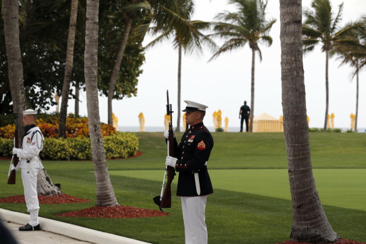 Military personnel stand for the arrival of Chinese President Xi Jinping and his wife Chinese first lady Peng Liyuan at Mar-a-Lago in Palm Beach, Fla., to meet with President Donald Trump and first lady Melania Trump.