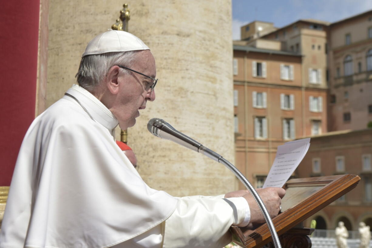 Pope Francis delivers his Urbi et Orbi (to the city and to the world) message from the main balcony of St. Peter&#039;s Basilica, at the Vatican on Sunday.