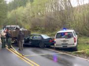 Two people were taken into custody Thursday after a driver allegedly tried to run over a Clark County Sheriff's Office deputy. The deputy fired on the vehicle, which fled but was found about 90 minutes later.