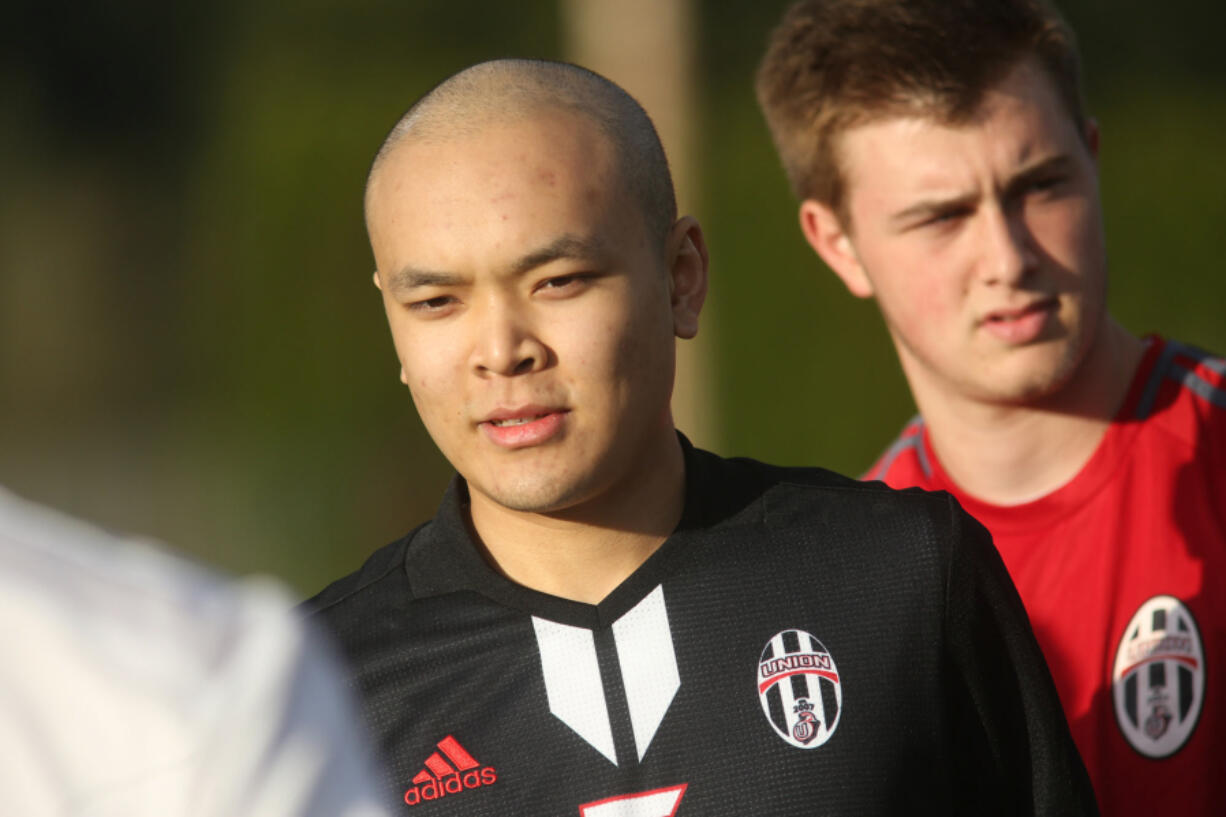 Kleon Keang stands with his Union teammates before a soccer game against Camas.