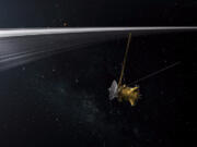 An artist&#039;s illustration of NASA&#039;s Cassini spacecraft crossing Saturn&#039;s ring plane. A maneuver this close to Saturn&#039;s surface was considered too risky earlier in Cassini&#039;s mission.