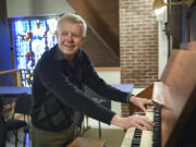 Ariane Kunze/The Columbian
Tim Nickel, the music director at St. Luke’s ~ San Lucas Episcopal Church in Vancouver, tries out the organ — built in 1895 — after a recent renovation.