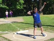 Ridgefield High School freshman Trey Knight competes in the shot put at the Class 2A District 4 meet Friday at Columbia River High School. Knight's winning mark of 60 feet, 9 inches is the farthest by a freshman in state history.