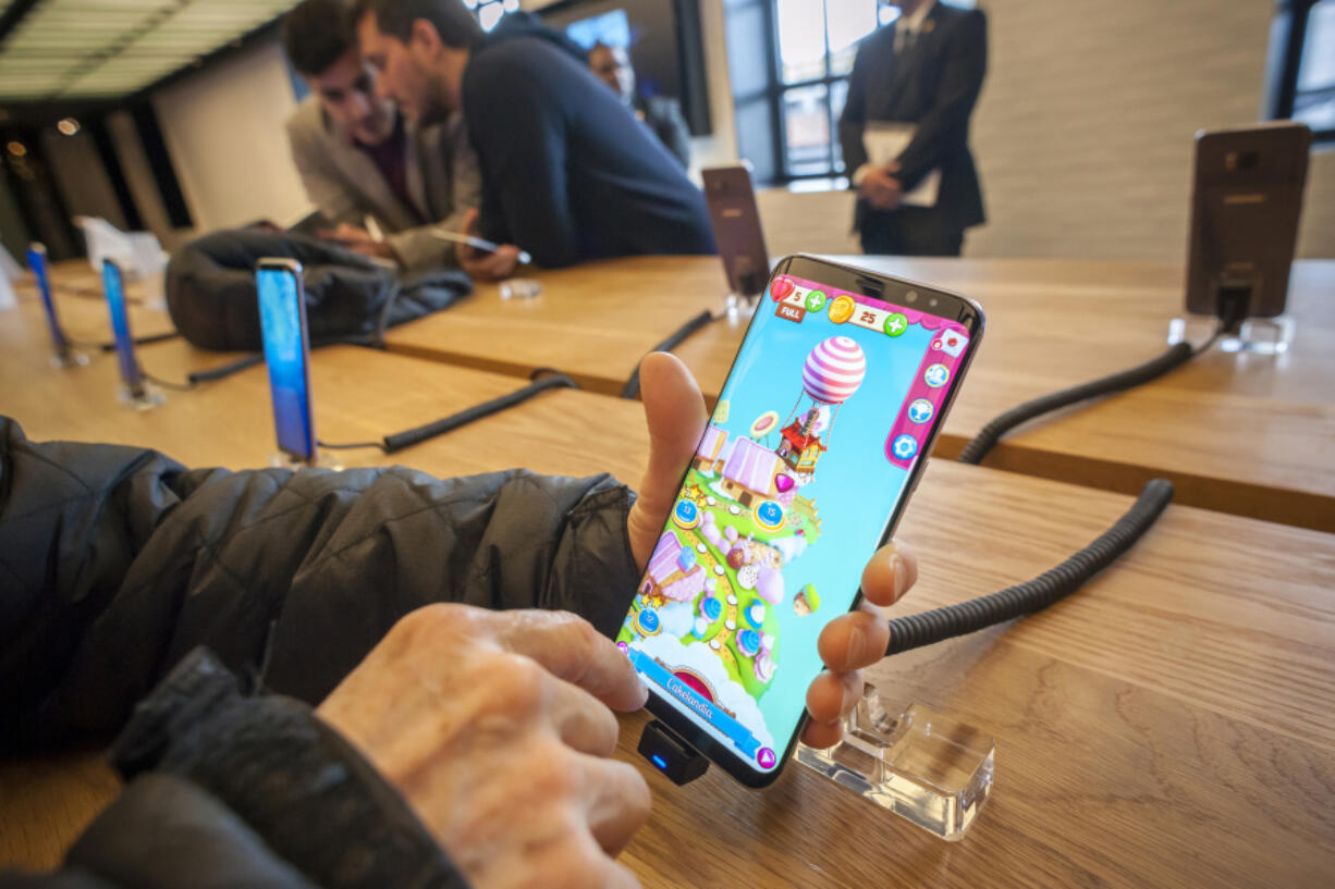 Visitors to the Samsung 837 showroom in New York admire the Samsung Galaxy S8+ smartphone on April 1. Richard B.